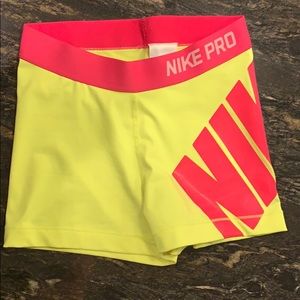 Neon yellow and pink nike pro compression shorts